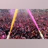 Indian Hindu devotees cheer as colored powder and water is sprayed on them by a Hindu priest during celebrations marking Holi at the Swaminarayan temple in Ahmedabad, India, March 10, 2020.