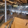 A lone security officer walks through an otherwise empty Seattle City Hall where most workers have been told to work from home in Seattle, March 16, 2020.