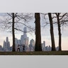 People work out in front of the skyline of lower Manhattan in New York City on Pier A in Hoboken, N.J., March 17, 2020. 