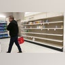 Shelves that held hand sanitizer and hand soap are mostly empty at a Target in Jersey City, N.J., Mar. 3, 2020.