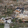 The remains of homes shattered by a tornado are scattered near Cookeville, Tenn., March 3, 2020. 