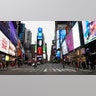 New York, New York: A nearly empty 7th Avenue in Times Square seen at rush hour after it was announced that Broadway shows will cancel performances.