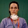 Martina Papponetti, 25, an ICU nurse at the Humanitas Gavazzeni Hospital, poses for a portrait at the end of her shift in Bergamo, Italy, March 27, 2020.