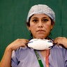 Anna Travezzano, 39, a nurse at the Humanitas Gavazzeni Hospital, poses for a portrait at the end of her shift in Bergamo, Italy, March 27, 2020.