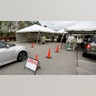 Health care providers with Sentara Princess Anne Hospital operate a drive-through testing station for patients who meet the criteria for the coronavirus in Virginia Beach, Va., March 16, 2020.
