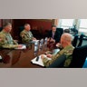New York Gov. Andrew Cuomo, center, meets with officers from the United States Army Corps of Engineers in Albany, N.Y., March 18, 2020.