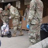 Members of the New York National Guard distributing food to families in New Rochelle.