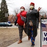 Voters arriving with masks in light of the coronavirus COVID-19 health concern at Warren E. Bow Elementary School in Detroit.