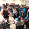 Voters waiting in line for the North Dakota Democrats' presidential caucus in a union hall in Fargo. The strong turnout forced party officials to bring in extra equipment and volunteers.