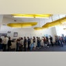 Voters wait in line to cast their ballots at a voting center in El Segundo, Calif.