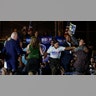 A demonstrator jumped at the stage as the presidential candidate Joe Biden speaks.