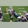 New England Patriots quarterback Tom Brady fumbles the ball as he is hit by Philadelphia Eagles defensive end Brandon Graham (55) during the fourth quarter in Super Bowl LII at U.S. Bank Stadium. 