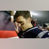 New England Patriots quarterback Tom Brady shakes hands with a fan as he leaves the field after losing an NFL wild-card playoff football game to the Tennessee Titans in Foxborough, Mass. 
