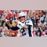  New England Patriots quarterback Tom Brady (12) reacts to a touchdown against the Washington Redskins during the second half of an NFL football game in Washington. Brady, the centerpiece of the New England Patriots’ championship dynasty over the past two decades, appears poised to leave the only football home he has ever had.