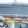 Ronny Young, of Port St. Joe, Florida, disembarks from the Caribbean Princess at Port Everglades in Fort Lauderdale, Fla. Wednesday, March 11, 2020. The cruise ship was given federal permission to dock in Florida after testing of two crew members cleared them of the new coronavirus and U.S. health officials lifted a “no sail" order.