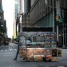 A food truck vendor pushes his cart down an empty street near Times Square in New York, on Sunday, March 15, 2020. President Donald Trump on Sunday called on Americans to cease hoarding groceries and other supplies, while one of the nation's most senior public health officials called on the nation to act with more urgency to safeguard their health as the coronavirus outbreak continued to spread across the United States.