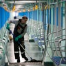 A Moscow metro depot employee disinfects a metro train in Moscow, Russia, on March 16, 2020. 