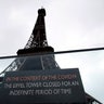 A screen announces the closure of the Eiffel Tower after the French government banned all gatherings of over 100 people to limit the spread of the virus COVID-19, in Paris, on March 14, 2020.