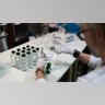 A worker fills a bottle with hand sanitizer solution made from distilled alcohol byproducts at the Glass Distillery in the SoDo neighborhood of Seattle, Wash., March 18, 2020.