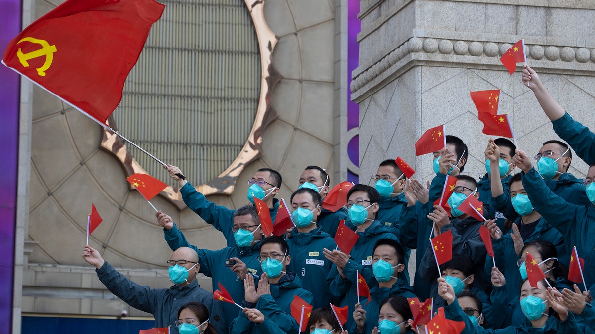 A farewell ceremony is held for the last group of medical workers who came from outside Wuhan to help the city during the coronavirus outbreak in Wuhan in central China's Hubei province on Wednesday, April 15, 2020.