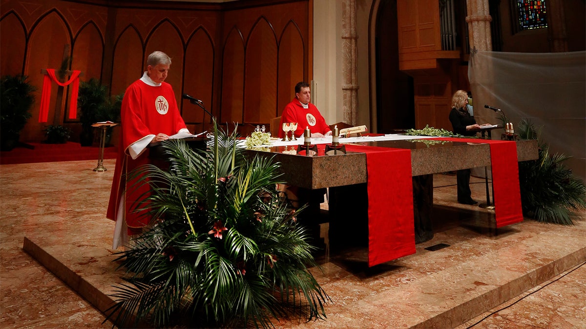 Father Marek Smolka, Associate Pastor and Director of Liturgy at Holy Name Cathedral, was the main celebrant during Mass taped in Polish for Palm Sunday on April 3, 2020 at Holy Name Cathedral in Chicago. In light of COVID-19 pandemic where all public Catholic Liturgies have been suspended since March 15, Masses have been taped and live-streamed in 3 languages for the faithful to worship online. (Karen Callaway/Chicago Catholic)