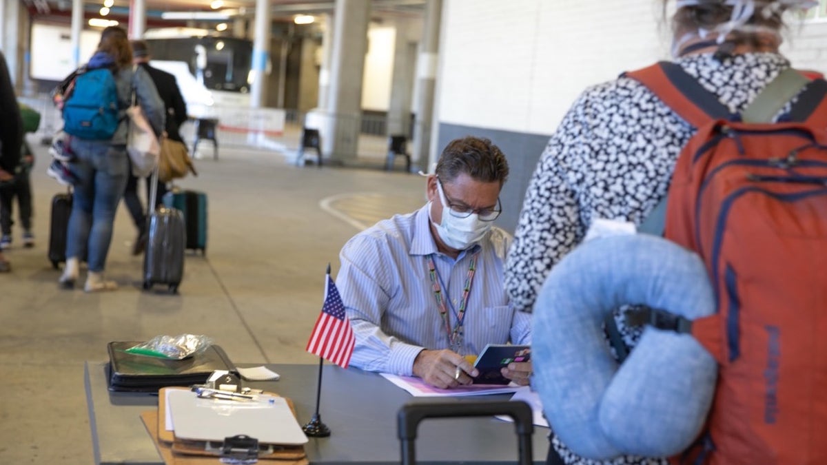 U.S. citizens checking in for their evacuation flight out of Johannesburg, South Africa.