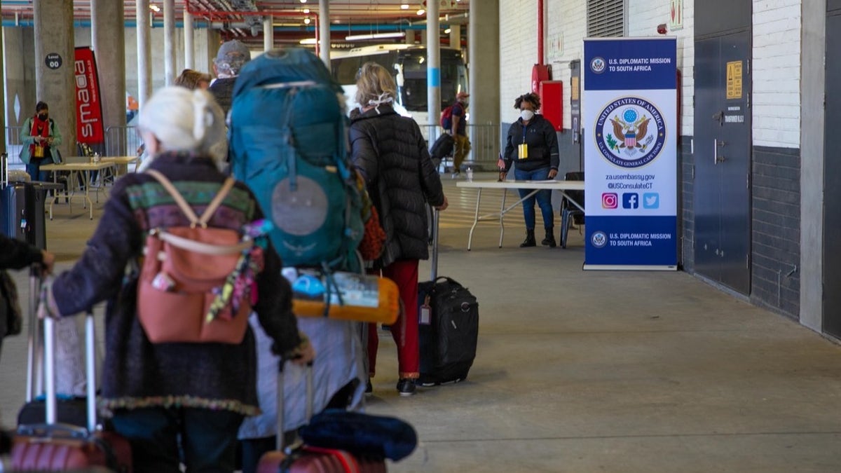 U.S. citizens stranded in South Africa ready to board an evacuation flight back to the United States.