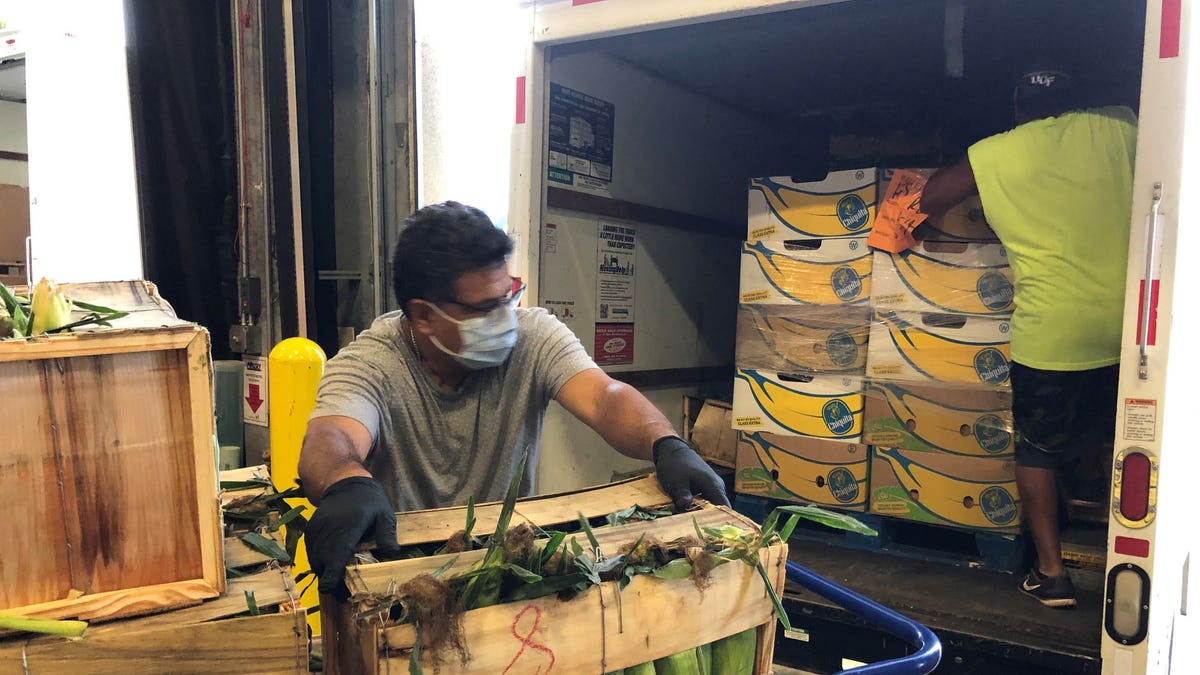 A worker unloads a delivery of produce at Second Harvest Food Bank of Central Florida (Erika Spence, Second Harvest Food Bank).