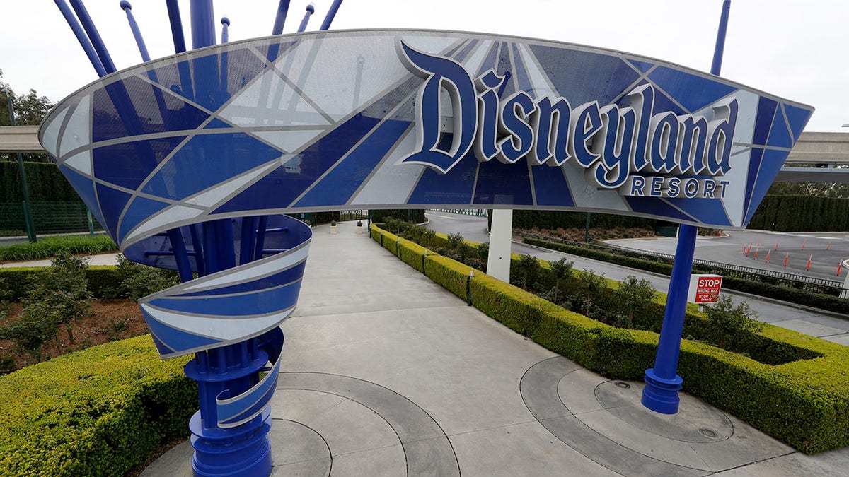 In this photo taken Wednesday, March 18, 2020, one of the normally bustling entrances to the Disneyland resort is vacant due to the coronavirus closure in Anaheim, Calif.  (AP Photo/Chris Carlson)