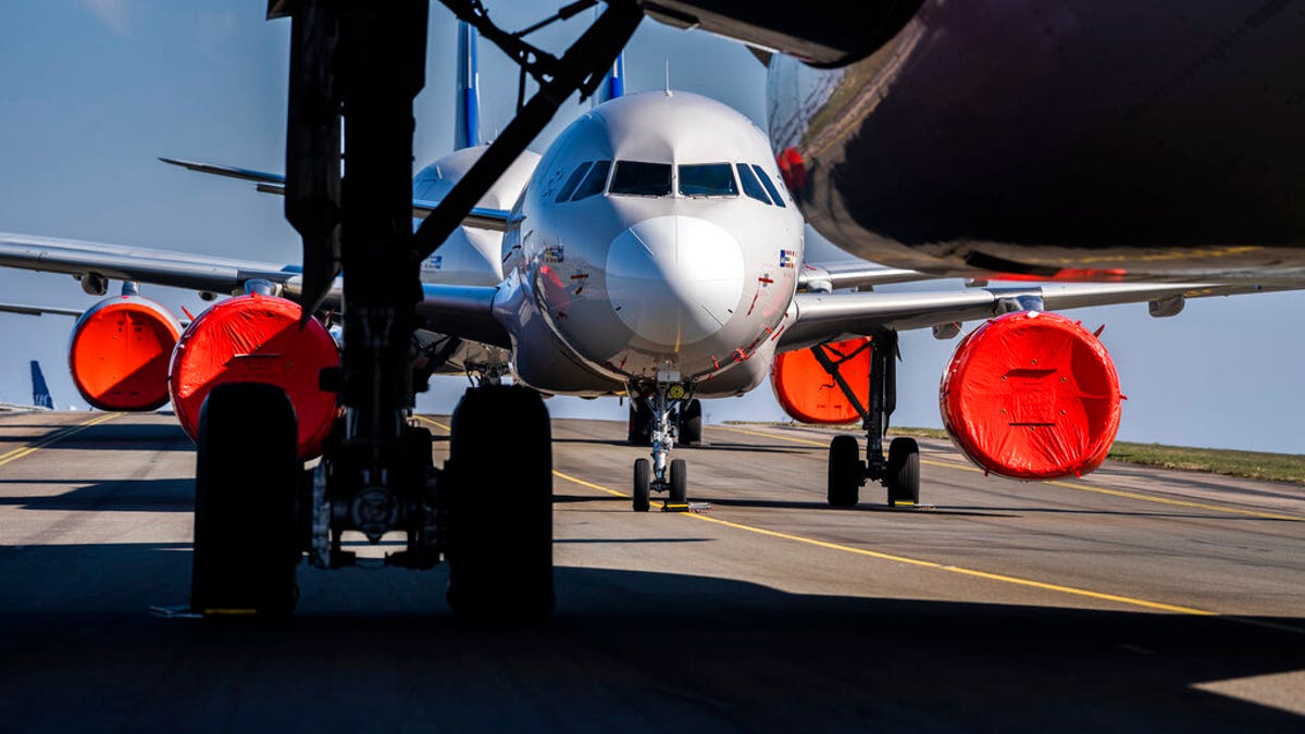 Empty runways and parked passenger aircraft are seen grounded at Copenhagen Airport, Denmark, Wednesday, March 25, 2020.