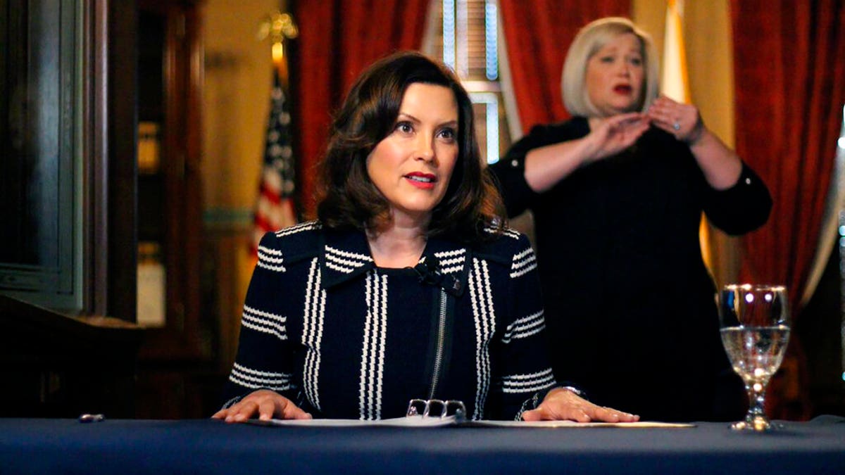 In this photo provided by the Michigan Office of the Governor, Michigan Gov. Gretchen Whitmer addresses the state during a speech in Lansing, Mich., Thursday, April 2, 2020.