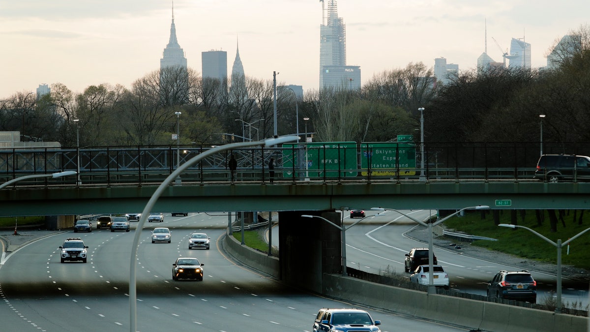 Car drivers move on the Grand Central Parkway during rush hour Tuesday, April 7, 2020, in the Queens borough of New York City.  (AP Photo/Frank Franklin II)