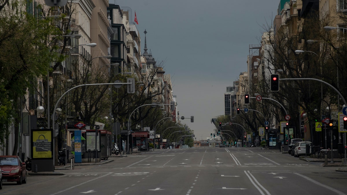 An empty street as the lockdown continues to combat the spread of coronavirus in downtown Madrid, Spain, Thursday. The new coronavirus causes mild or moderate symptoms for most people, but for some, especially older adults and people with existing health problems, it can cause more severe illness or death. (AP Photo/Manu Fernandez)