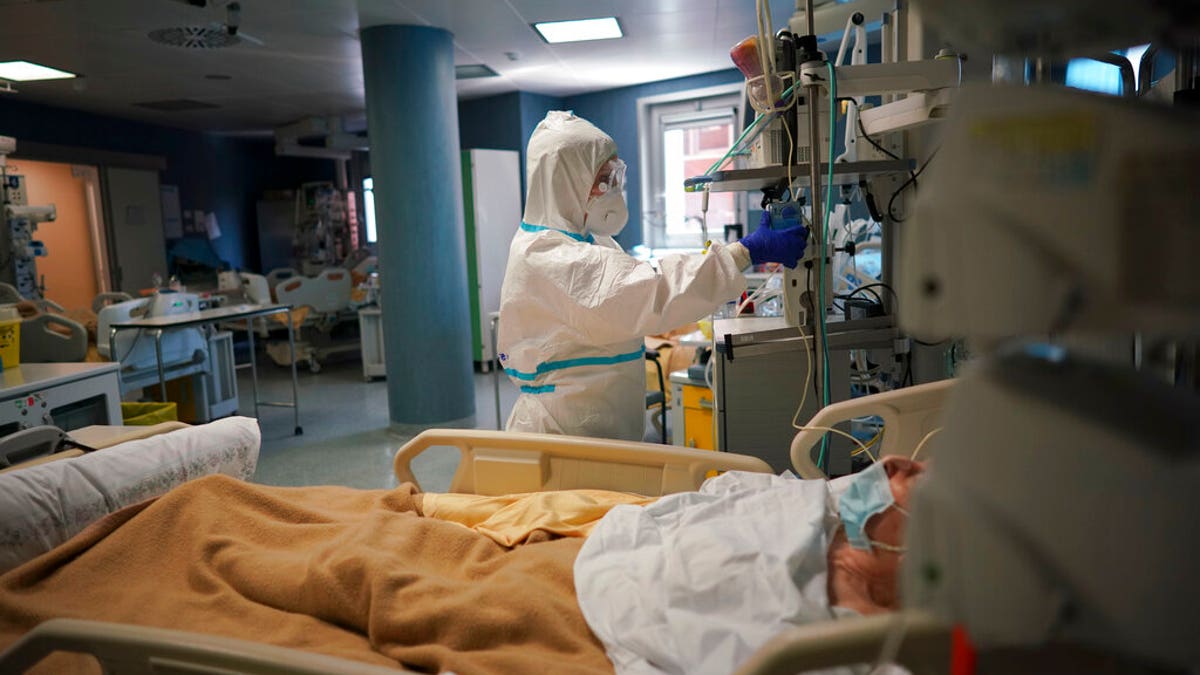 Medical staff tends to a patient in the ICU unit of Rome's San Filippo Neri Hospital's Covid department, in Rome, Thursday, April 9, 2020.