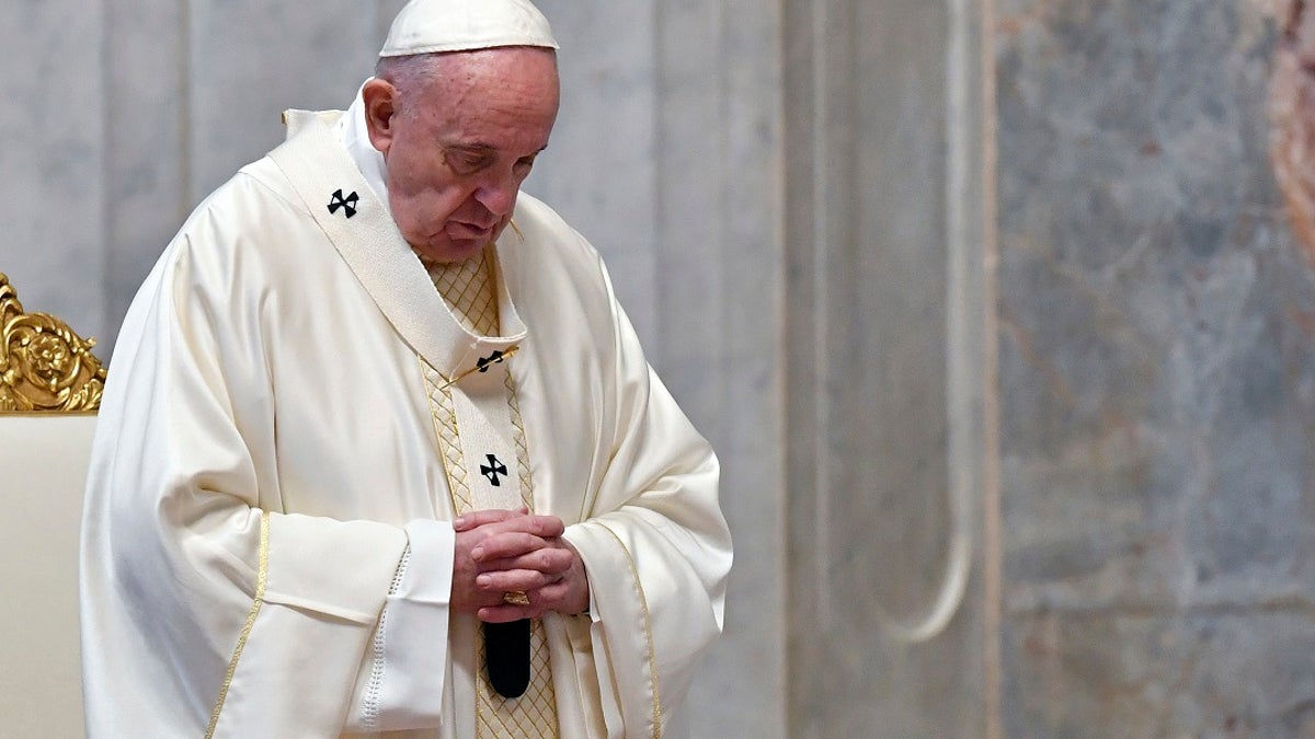 Pope Francis attends a Mass for Holy Thursday, inside St. Peter's Basilica at the Vatican. (Alessandro Di Meo/Pool Photo via AP)
