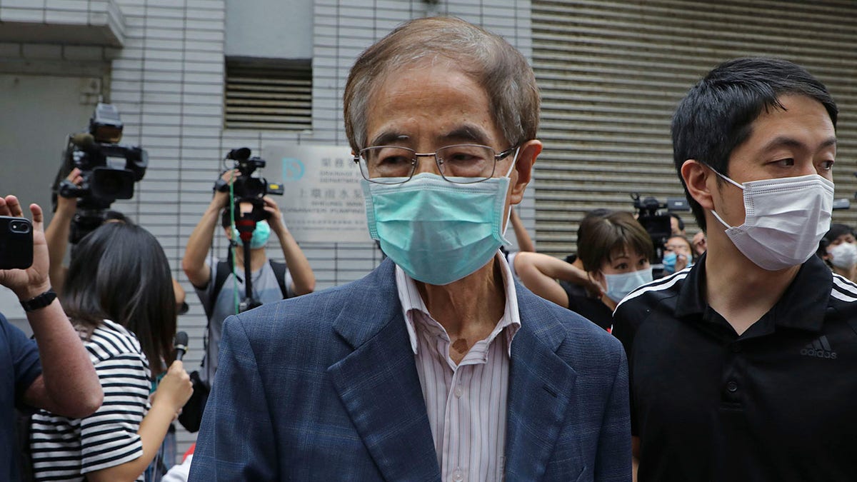 Former pro-democracy lawmaker Martin Lee, 81, center, leaves a police station in Hong Kong, Saturday, April 18, 2020. (Associated Press)