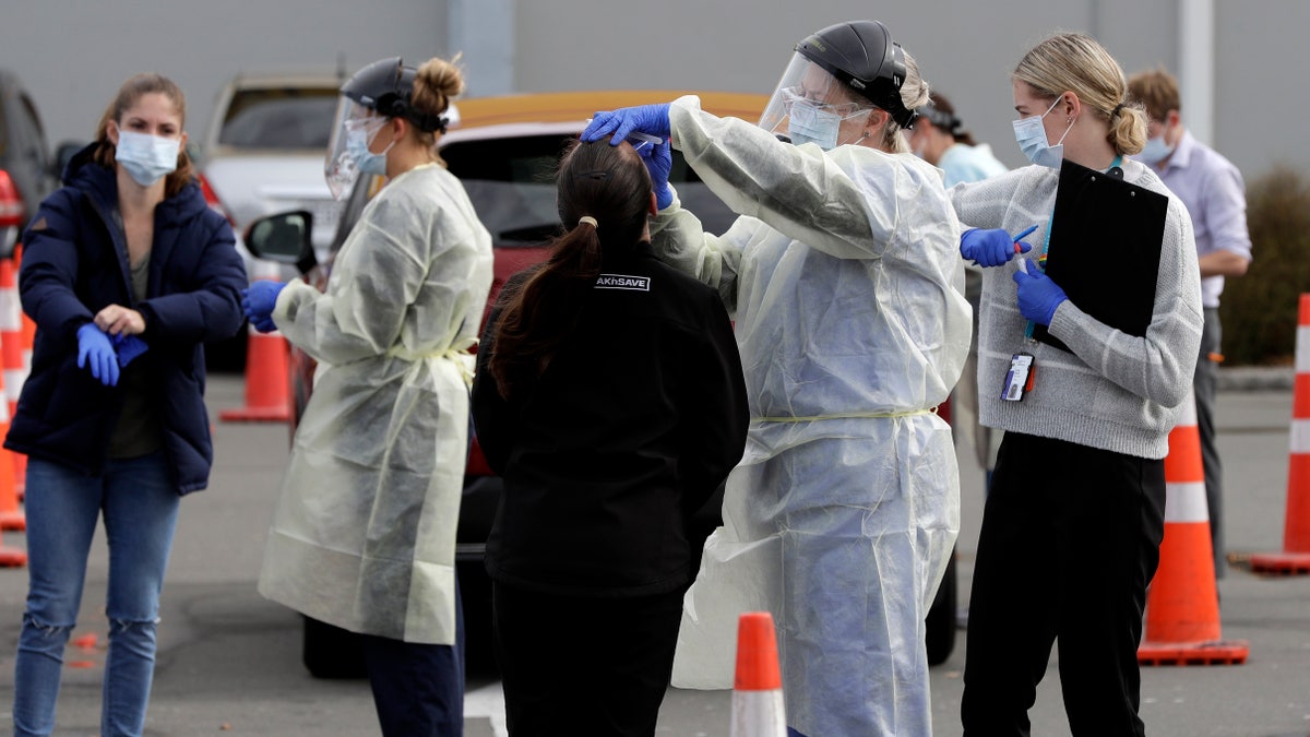 Medical staff test shoppers at a pop-up community COVID-19 testing station at a supermarket parking lot in Christchurch, New Zealand, on Friday. (AP)