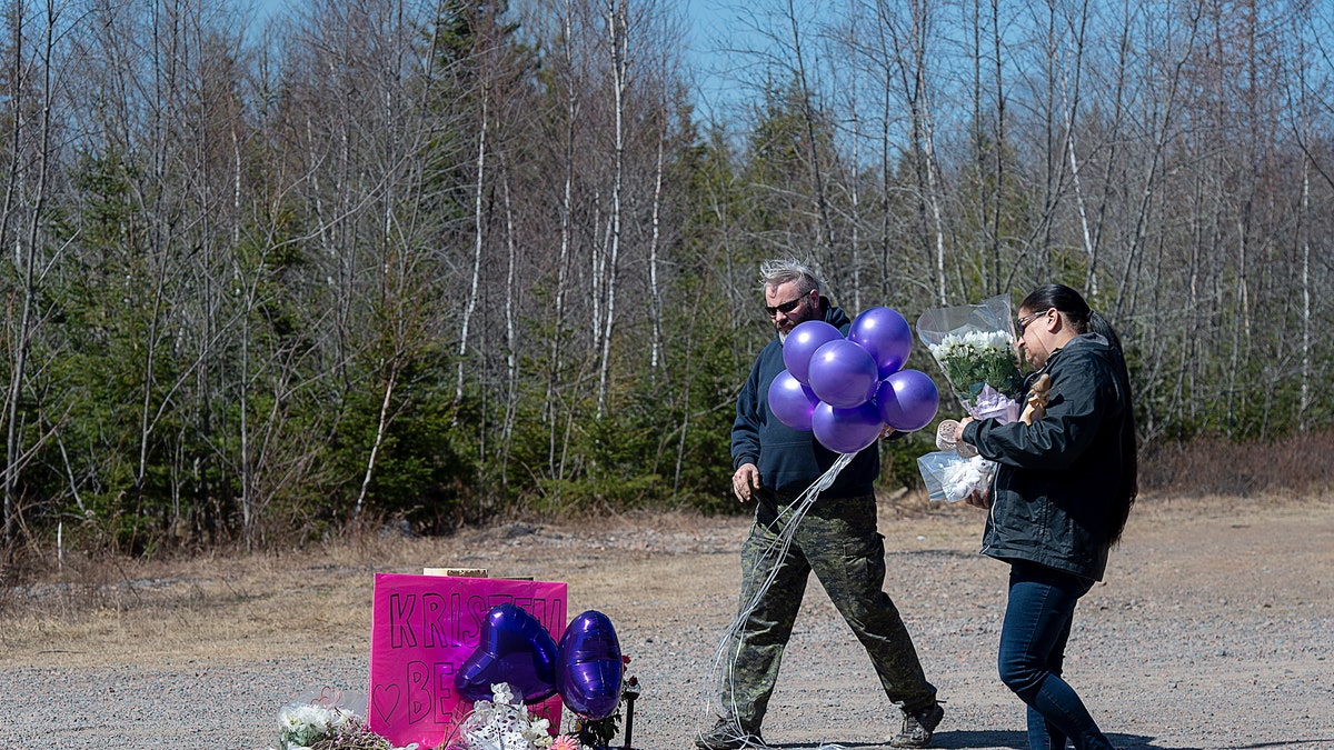 A memorial pays tribute to health-care worker Kristen Beaton along the highway in Debert, Nova Scotia, on Tuesday, April 21, 2020. (Andrew Vaughan/The Canadian Press via AP)