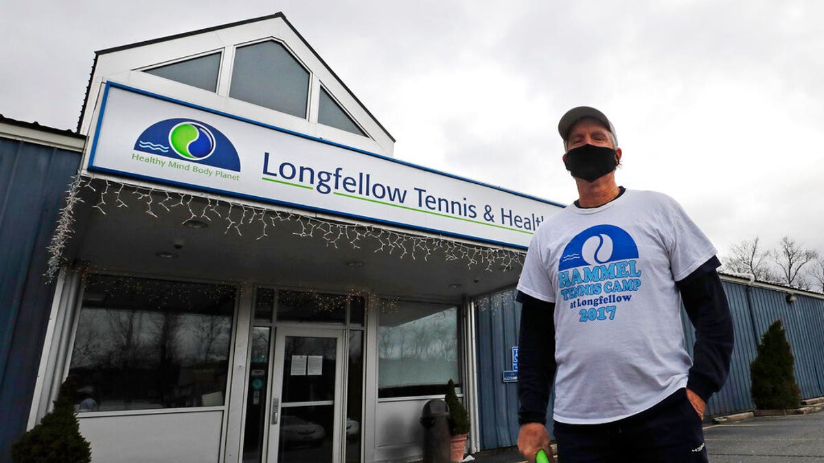 In this Tuesday April 21, 2020 photograph, Laury Hammel, CEO and founder of the Longfellow Health Clubs and the Salt Lake Tennis and Health Club, poses at the Wayland, Mass. facility, closed due state COVID-19 restrictions.
