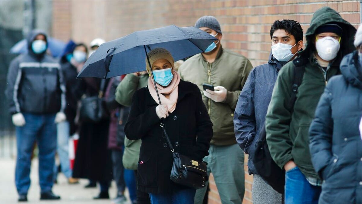 People line up at Gotham Health East New York, a COVID-19 testing center  April 23, in the Brooklyn borough of New York. 