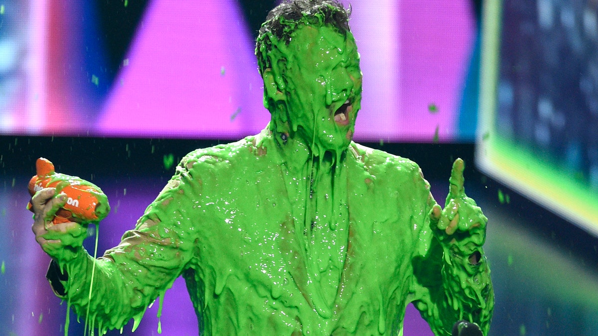 In this March 23, 2019 file photo, Chris Pratt reacts after getting slimed as he accepts the award for favorite butt-kicker for 'Jurassic World: Fallen Kingdom' at the Nickelodeon Kids' Choice Award in Los Angeles. 