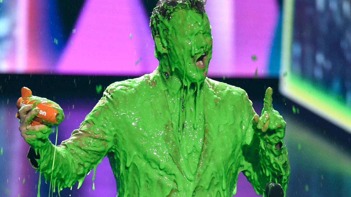 In this March 23, 2019 file photo, Chris Pratt reacts after getting slimed as he accepts the award for favorite butt-kicker for 'Jurassic World: Fallen Kingdom' at the Nickelodeon Kids' Choice Award in Los Angeles.