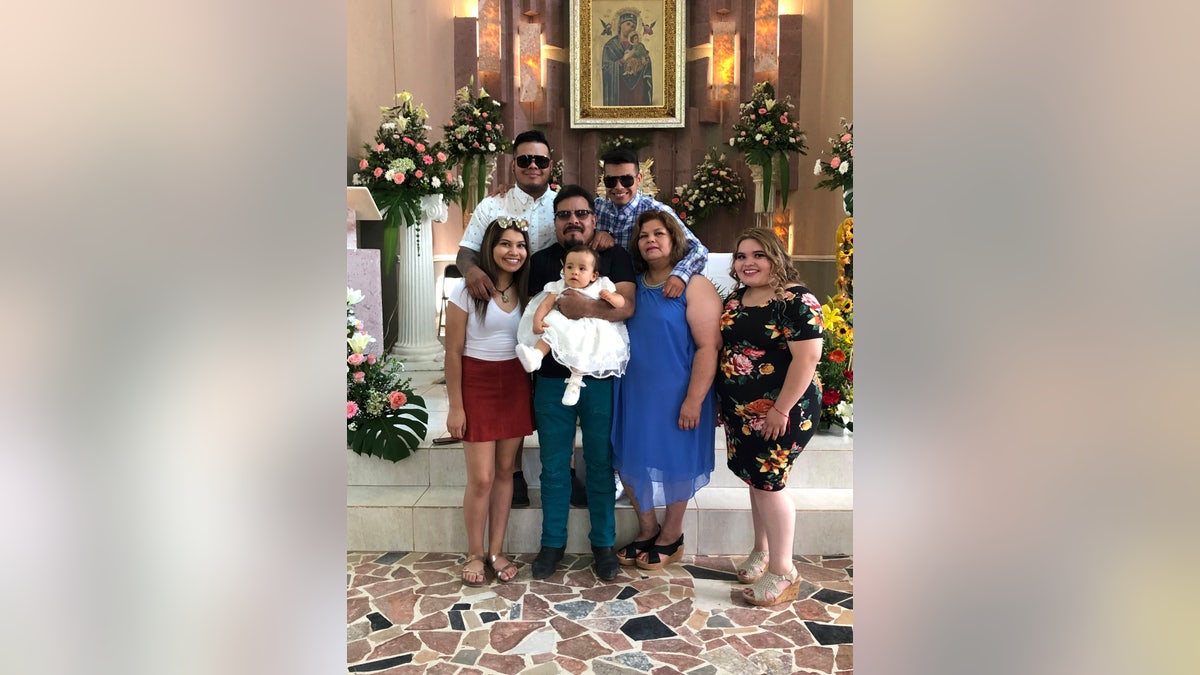 The Martinez Family of West Liberty, Iowa is pictured in June 2019 in the town of Ignacio Allende, Mexico. The coronavirus has swept through the family in the last three weeks. Jose Gabriel Martinez, holding his granddaughter in the center of the photo, died on Tuesday, April 21, 2020, at age 58. Aurelia Martinez, second from right, tested positive on April 3 but has recovered. Their 22-year-old daughter Evelyn, bottom right, has been hospitalized since April 10. Evelyn's older brother, Omar Martinez, top left, says the experience has been devastating.