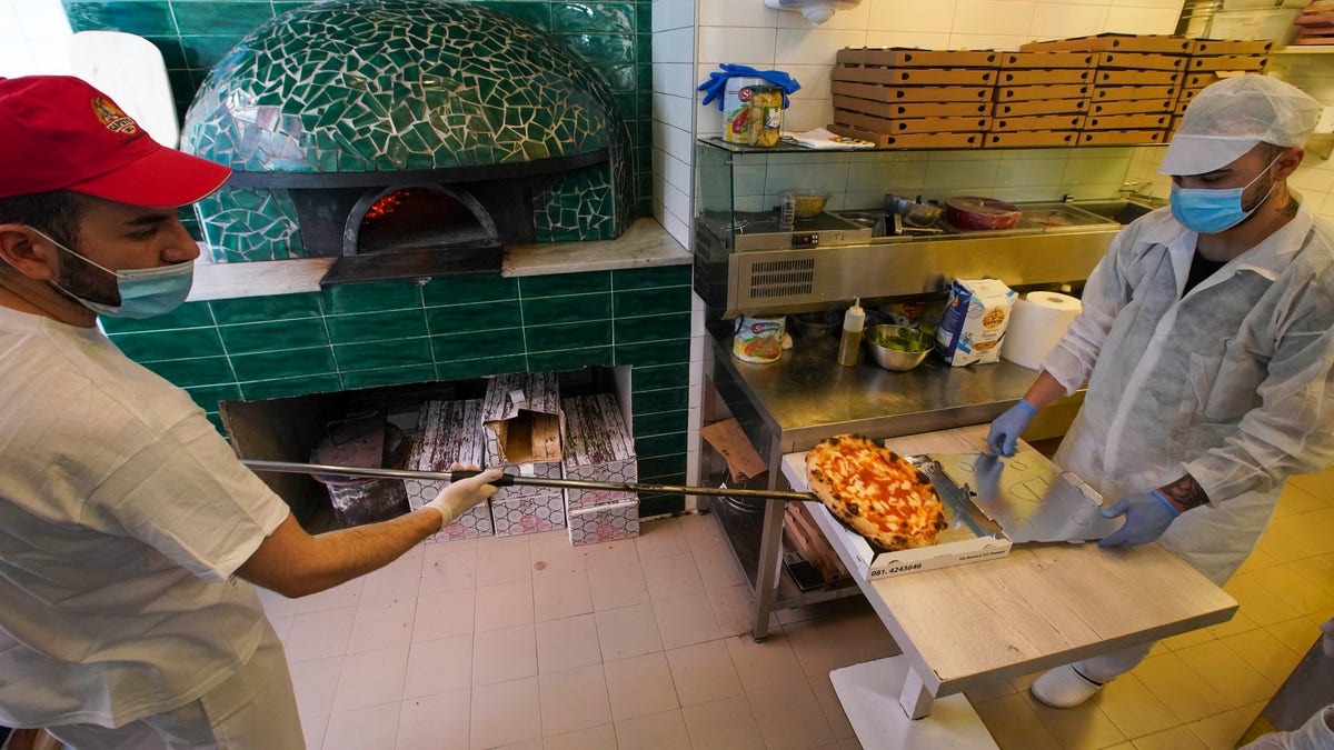 Naples is reportedly home to over 900 pizzerias, the most of any Italian city. (AP Photo/Andrew Medichini)
