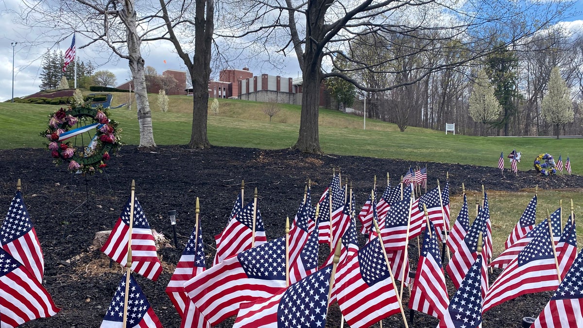 Flags and wreaths honor veterans April 28, 2020, on the grounds of the Soldiers' Home in Holyoke, Mass., where a number of people died due to the coronavirus. While the death toll at the state-run Holyoke Soldiers' Home continues to climb, federal officials are investigating whether residents were denied proper medical care while the state's top prosecutor is deciding whether to bring legal action. (AP Photo/Rodrique Ngowi)