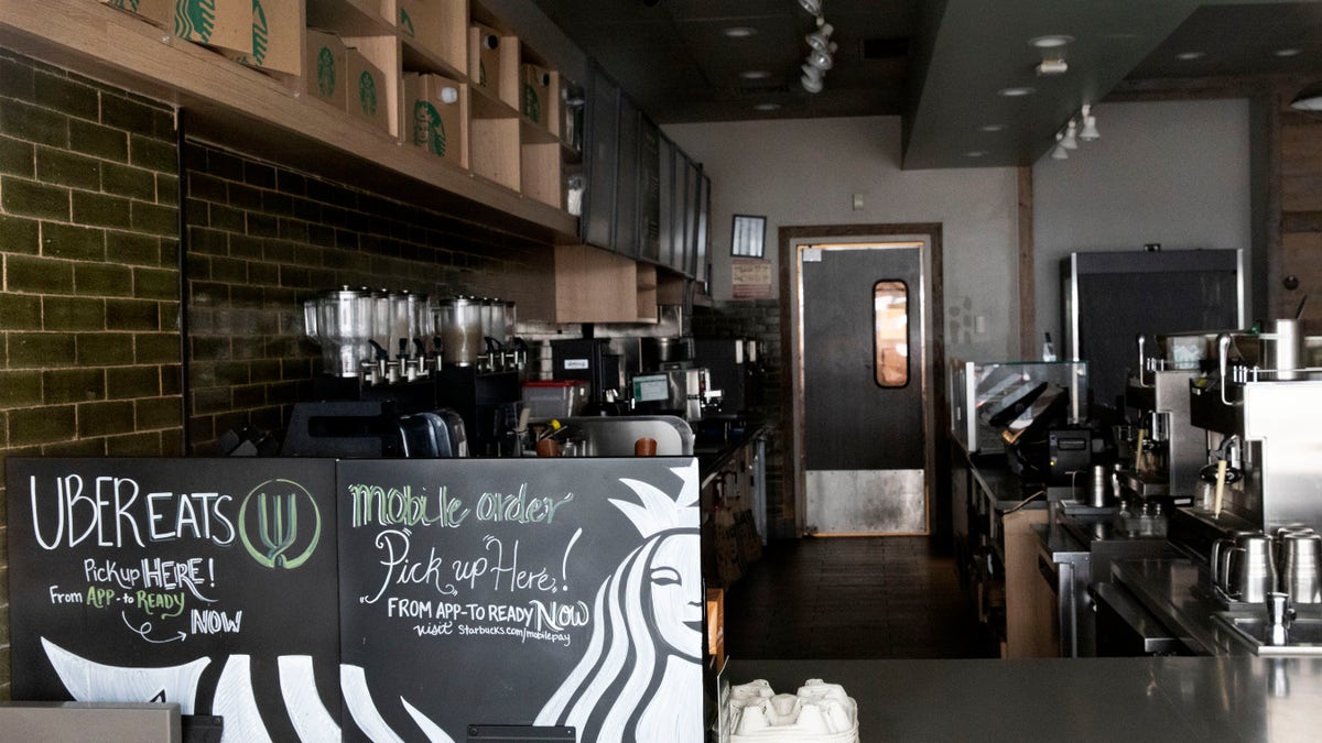 This Thursday, March 19, 2020 file photo shows a closed Starbucks coffee shop in the Brooklyn borough of New York, during the COVID-19 coronavirus outbreak.