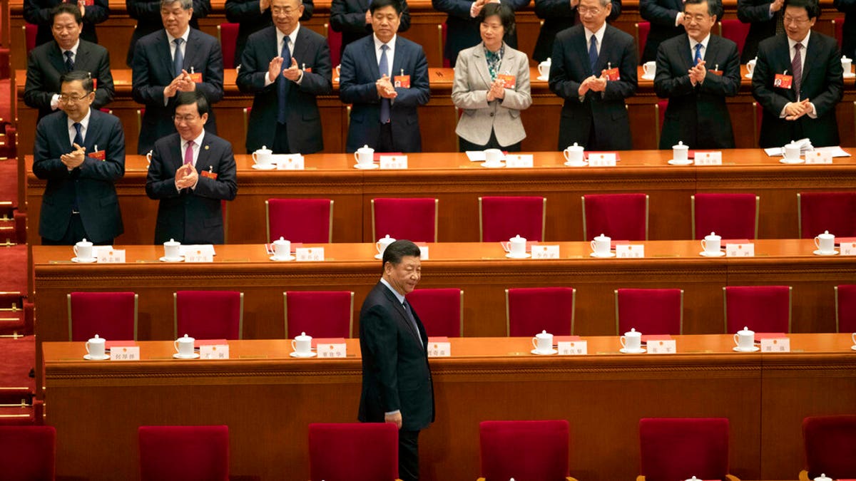 In this March 15, 2019, file photo, Chinese President Xi Jinping arrives for the closing session of the National People's Congress in Beijing's Great hall of the People. China has decided to hold the annual meeting of its ceremonial parliament late next month after postponing it for weeks because of the coronavirus outbreak. The official Xinhua News Agency said the National People's Congress would open in Beijing on May 22. 