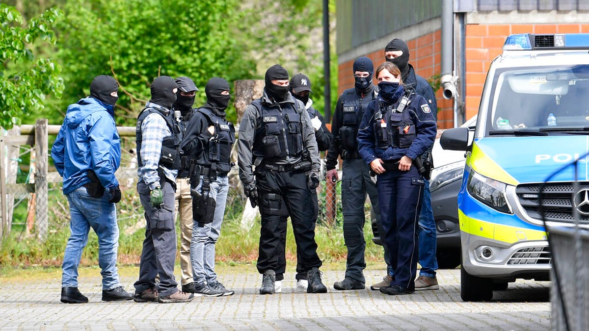 Special police investigates the Hezbollah linked Imam Mahdi center in Muenster, western Germany, Thursday, April 30, 2020. German police raided five sites linked to the Lebanese militant group Hezbollah, as authorities announced Thursday that they were banning activities by its political wing in Germany.