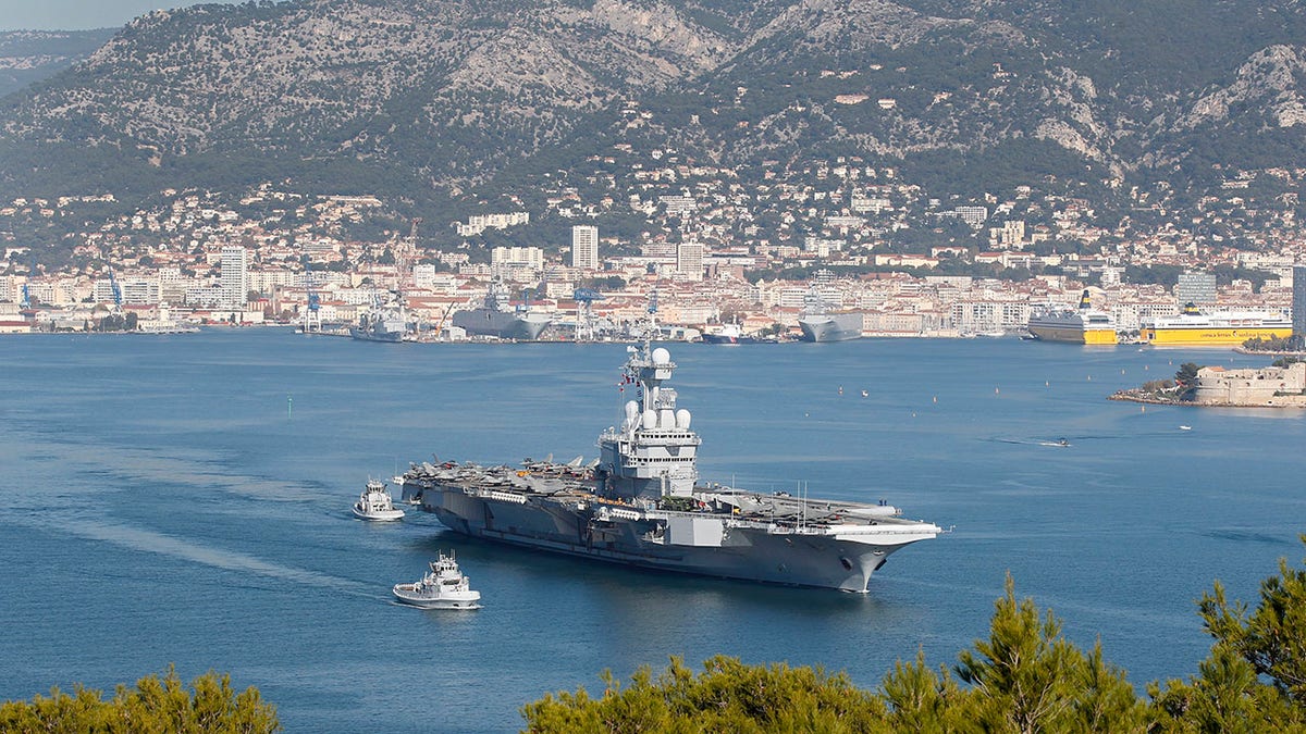 France's defense ministry announced that French aircraft carrier Charles de Gaulle is heading back to port amid possible virus outbreak onboard. (AP Photo/Lionel Cironneau, File)