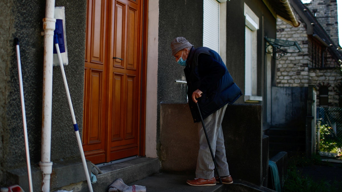 French doctor Christian Chenay, 98 year-old, arrives at his doctor's office in Chevilly-Larue near Paris as the spread of the coronavirus disease (COVID-19) continues in France April 14, 2020. Picture taken April 14, 2020. (REUTERS/Gonzalo Fuentes)